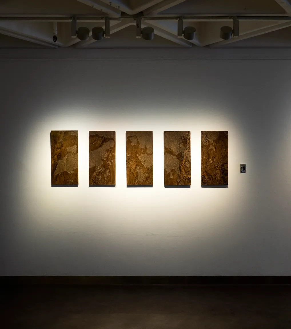A installation view of 'All Downhill From Here' (2022 - 2047), A painting from Damian Boylan's Acid Paintings series, where acid is progressively painted on to a marble substrate, over a 10 year period, to progressively erode the underlying material.
