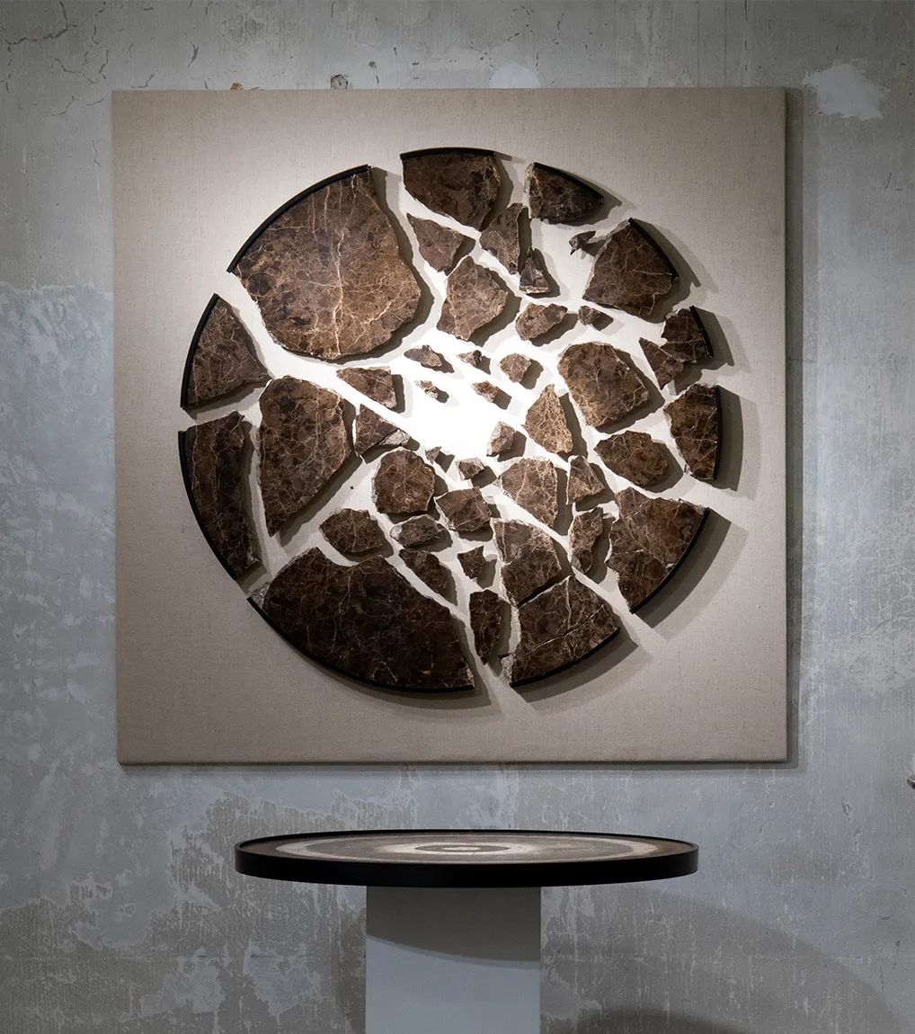 A installation view of 'Disintegration' (2021 - 2031), A painting from Damian Boylan's Acid Paintings series, where acid is progressively painted on to a marble substrate, over a 10 year period, to progressively erode the underlying material.