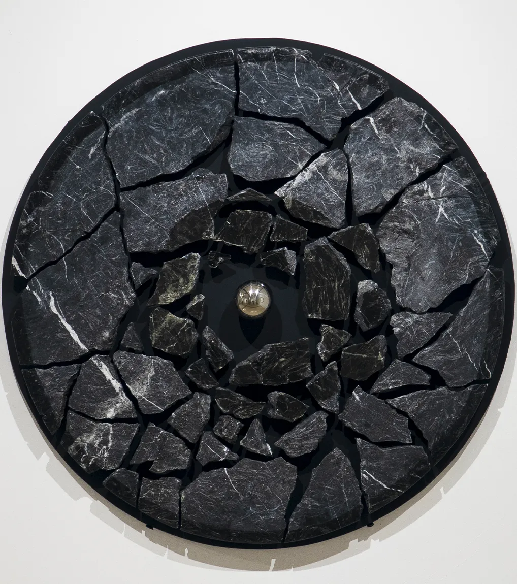 An installation view of 'Monad: Second Chance' (2023), A painting from Damian Boylan's Acid Paintings series, where acid is progressively painted on to a marble substrate to progressively erode the underlying material.