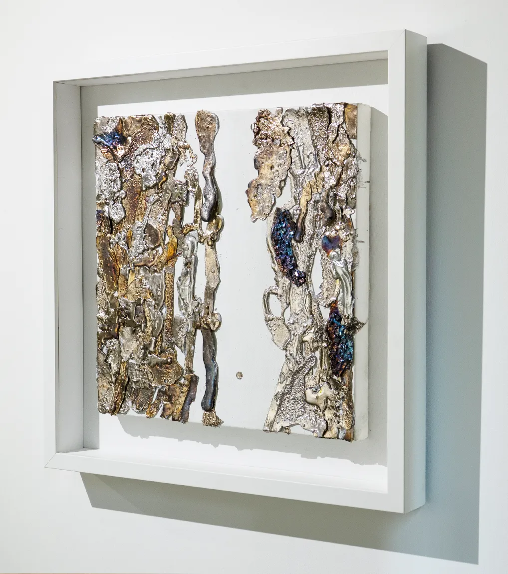 An oblique installation view of ‘A Study for Half-Life’ (2023) by Damian Boylan. A painting from his Elements Paintings series using molten rare earth bismuth metal on cotton canvas.