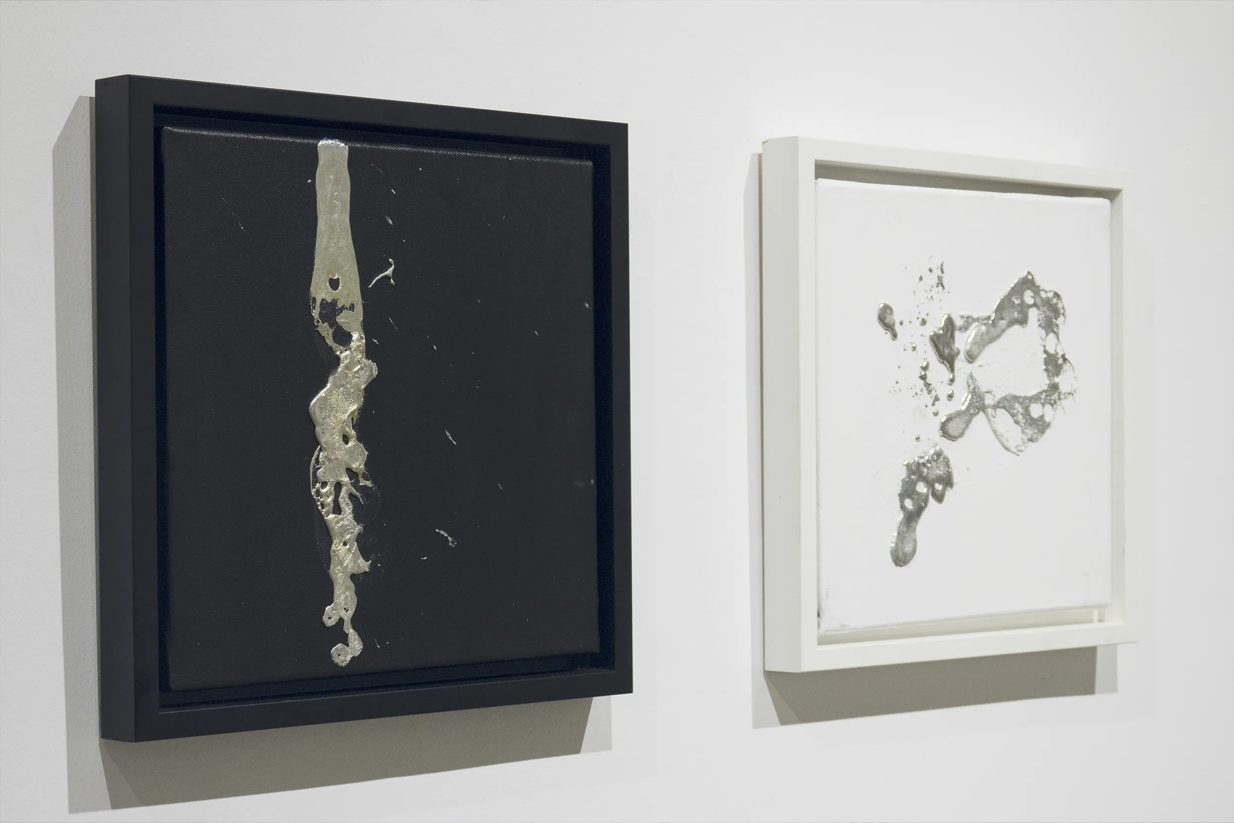 An installation view of ‘Reductionist Line and Circle (Diptych)’ (2020) by Damian Boylan. Paintings from his Elements Paintings series using molten rare earth indium metal on cotton canvas.