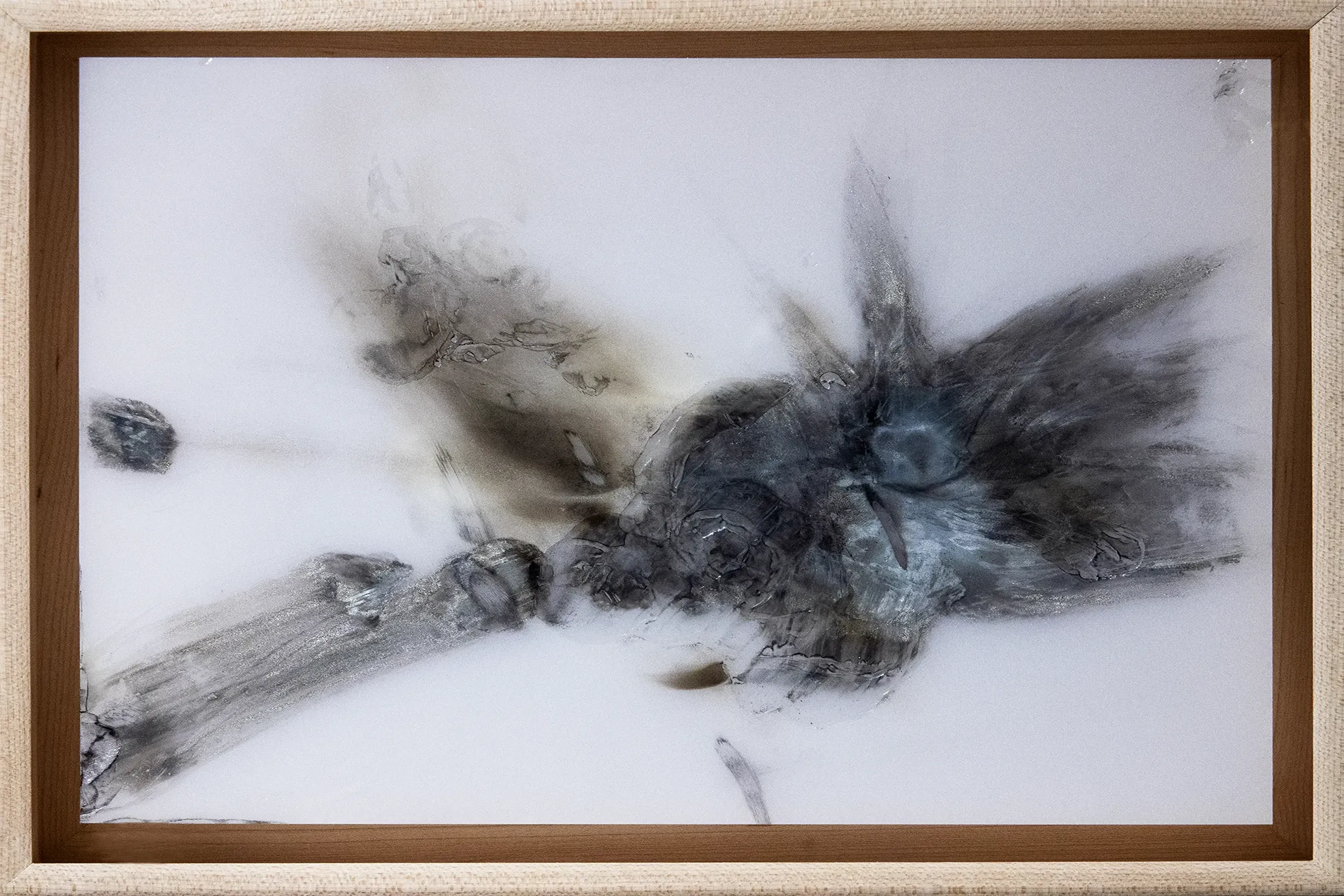 An installation view of Pearl, 2020, a painting from artist Damian Boylan's Rarefactions series, showing molten brass leaving an iridescent residual mark on a poly(methyl methacrylate) canvas.